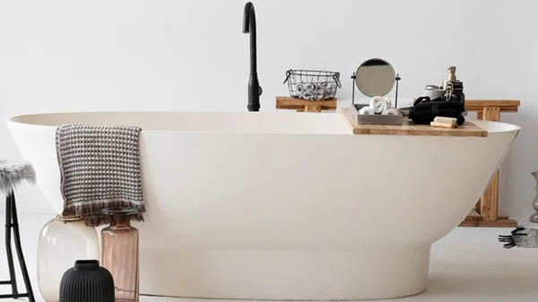 Indoor bathtub being carefully moved through a doorway