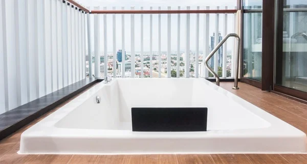 Outdoor bathtub being detached and prepared for moving