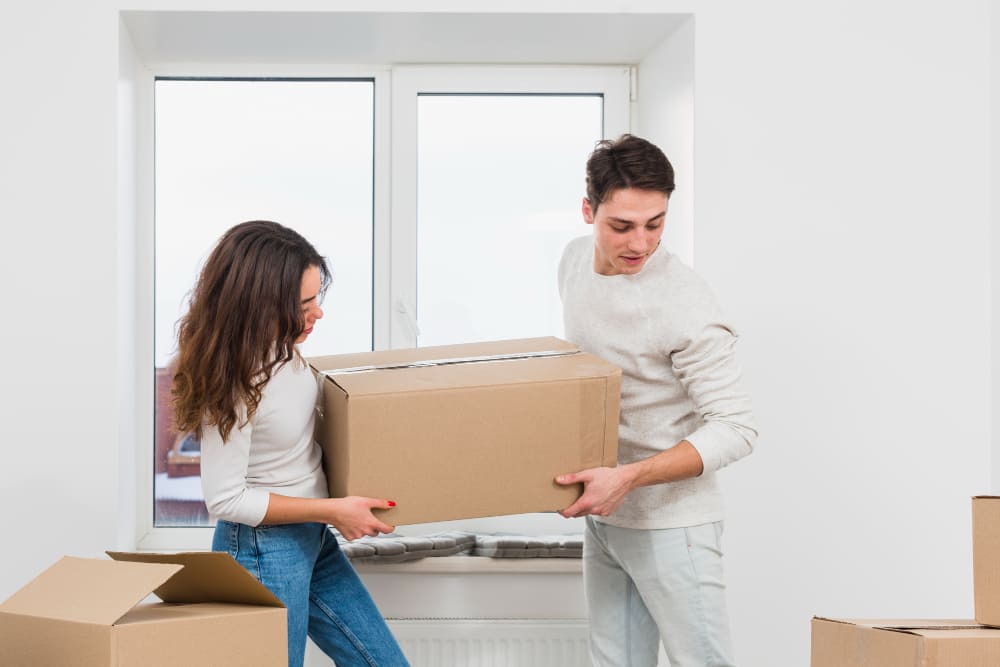 Couple moving boxes