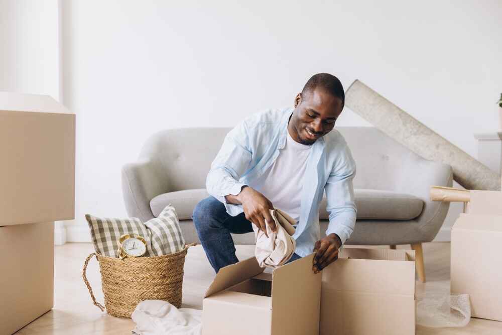 A Man Packing His House Before Moving From Melbourne to Brisbane