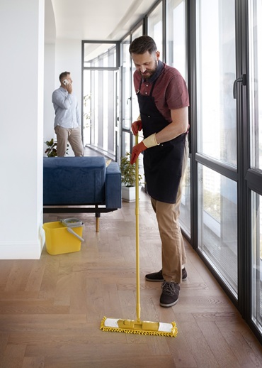 Man cleaning house during End of Lease Cleaning Services