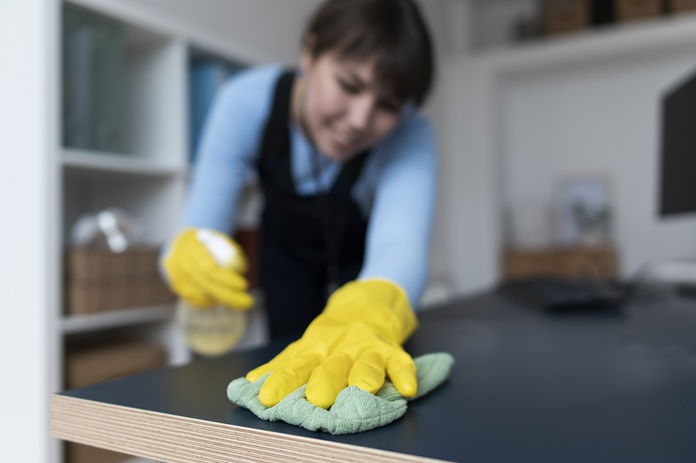 Woman cleaning house during End of Lease Cleaning Services